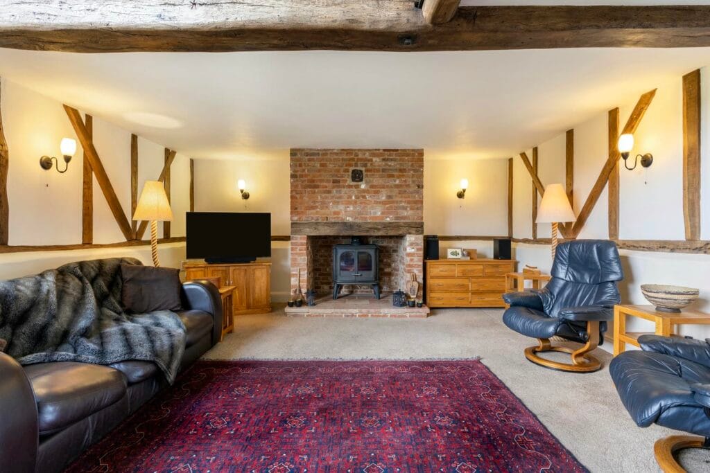 Spacious living room with wood burning stove