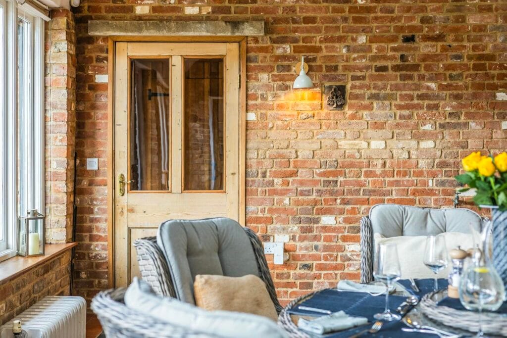 Sunroom with rustic brick charm