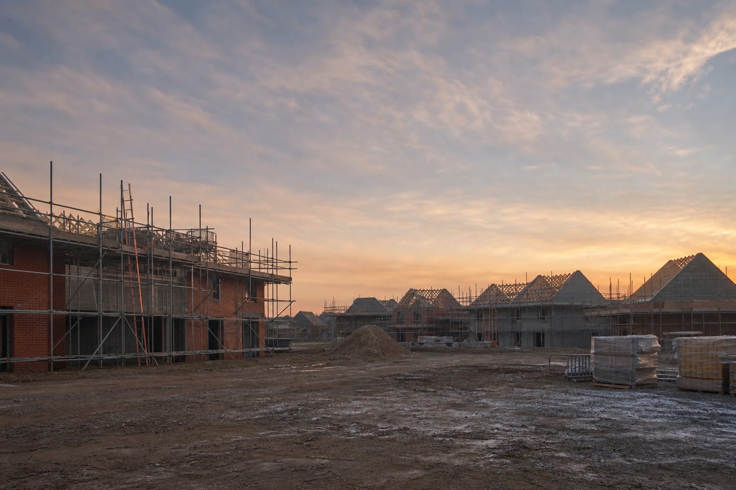 Partly built new housing development on the edge of a Norfolk town at dawn