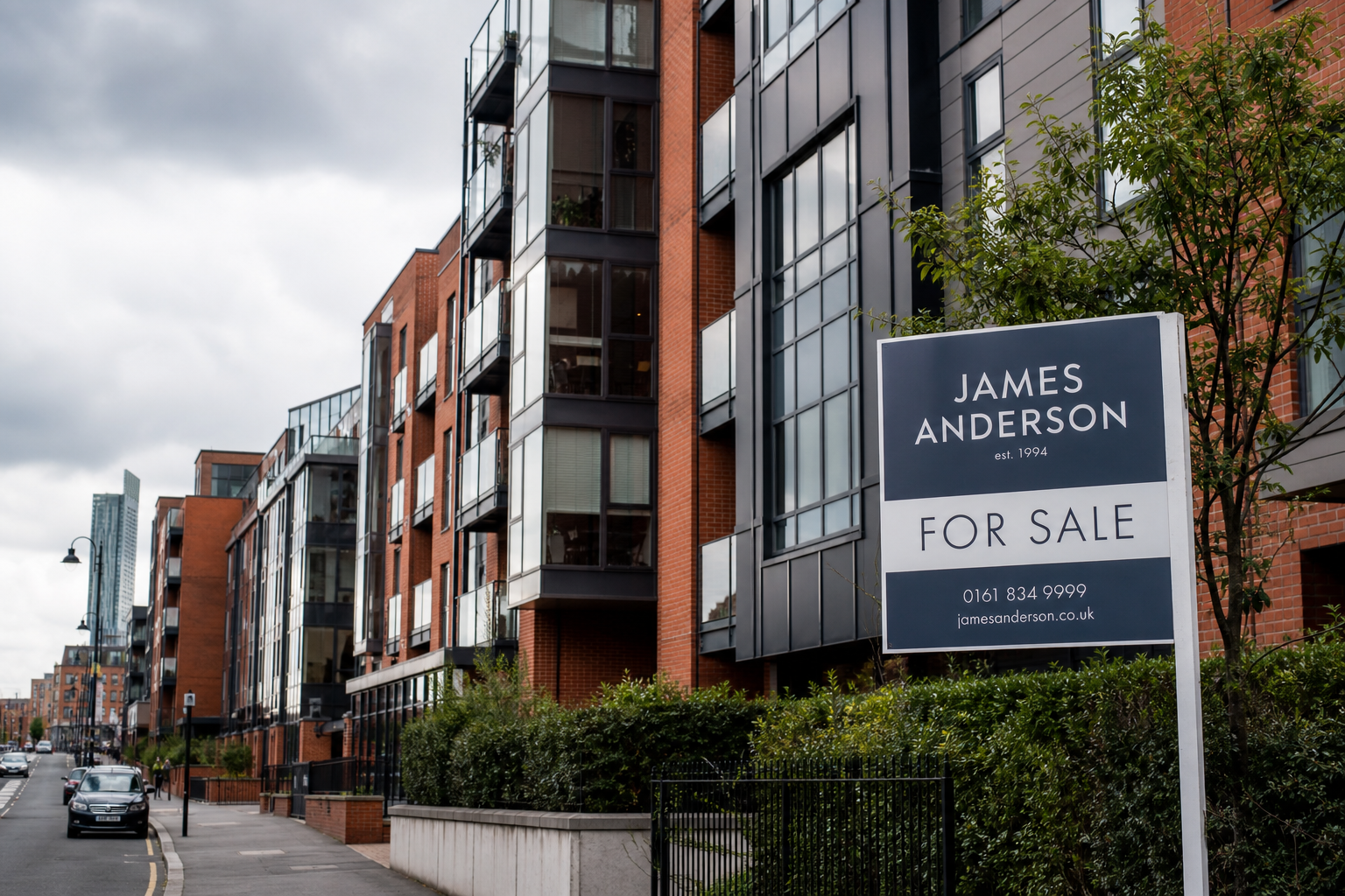 Modern apartment buildings in a British city centre with For Sale sign