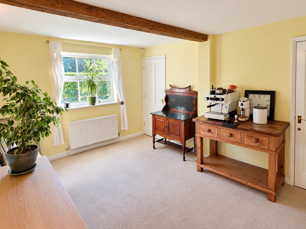 Study with exposed beam, sash window and antique furniture in Loddon Hall Cottage, Norfolk