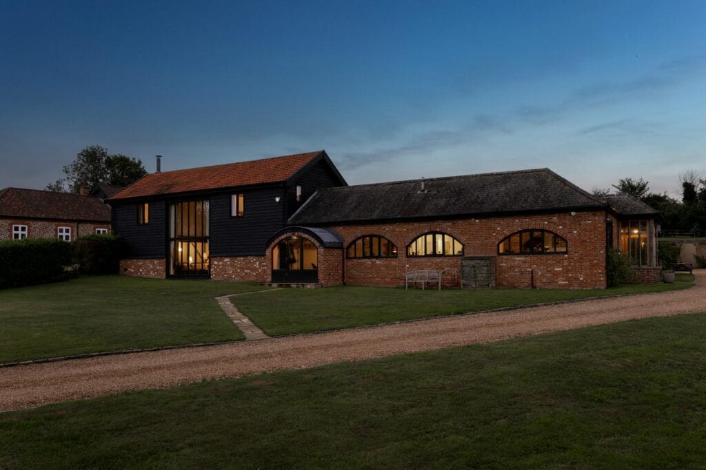 Front View – Mill Farm Barn at Dusk