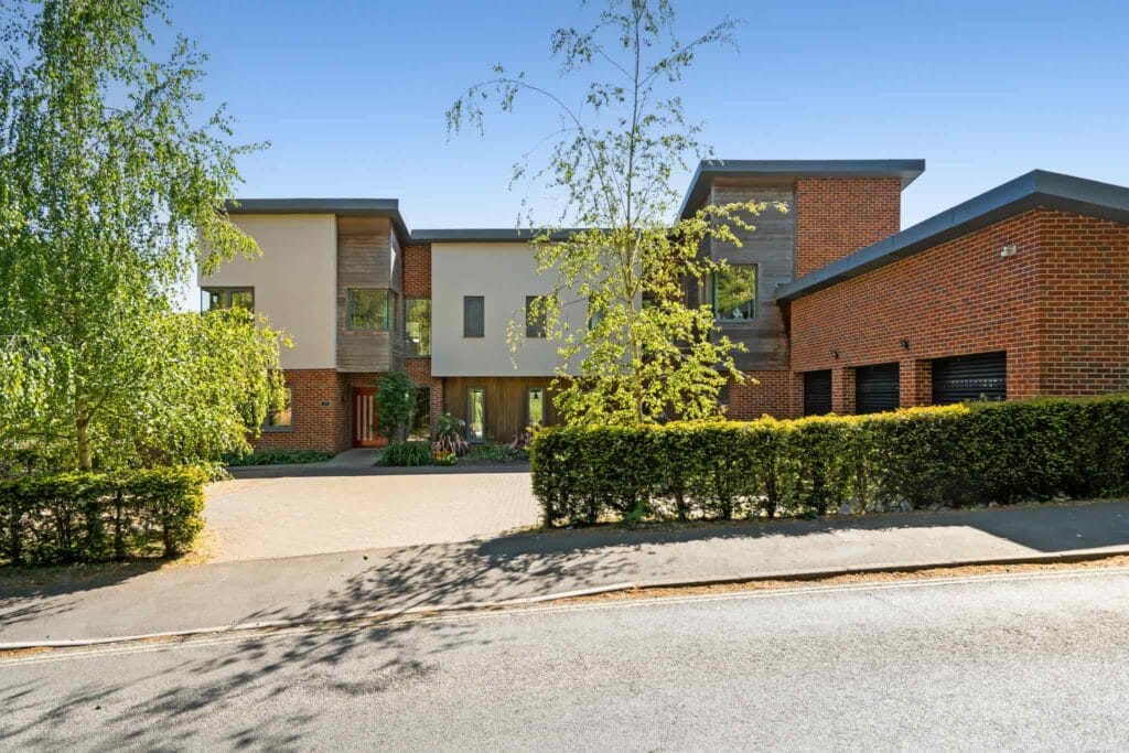 Contemporary front elevation with triple garage.