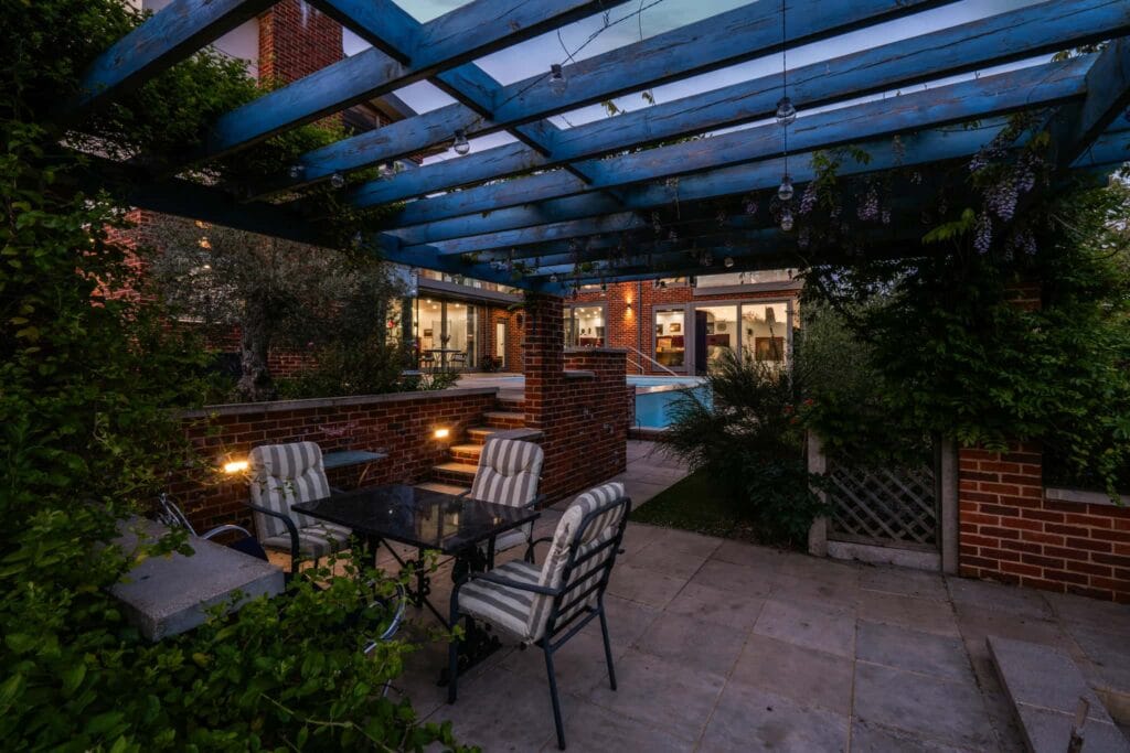 Evening pergola view with ambient lighting.
