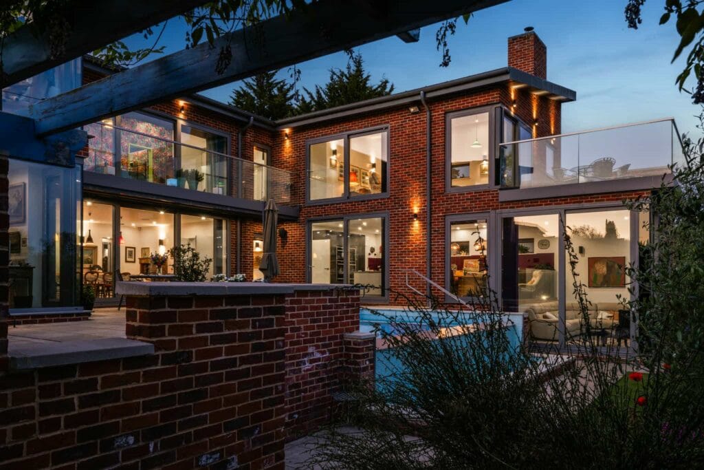 Evening terrace and pool view with warm lighting.