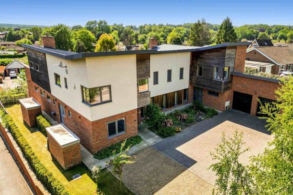 Striking contemporary façade with bold architectural lines, welcoming you into a home of modern luxury.