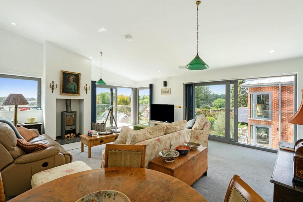 Upstairs living room/studio with balcony and panoramic views.
