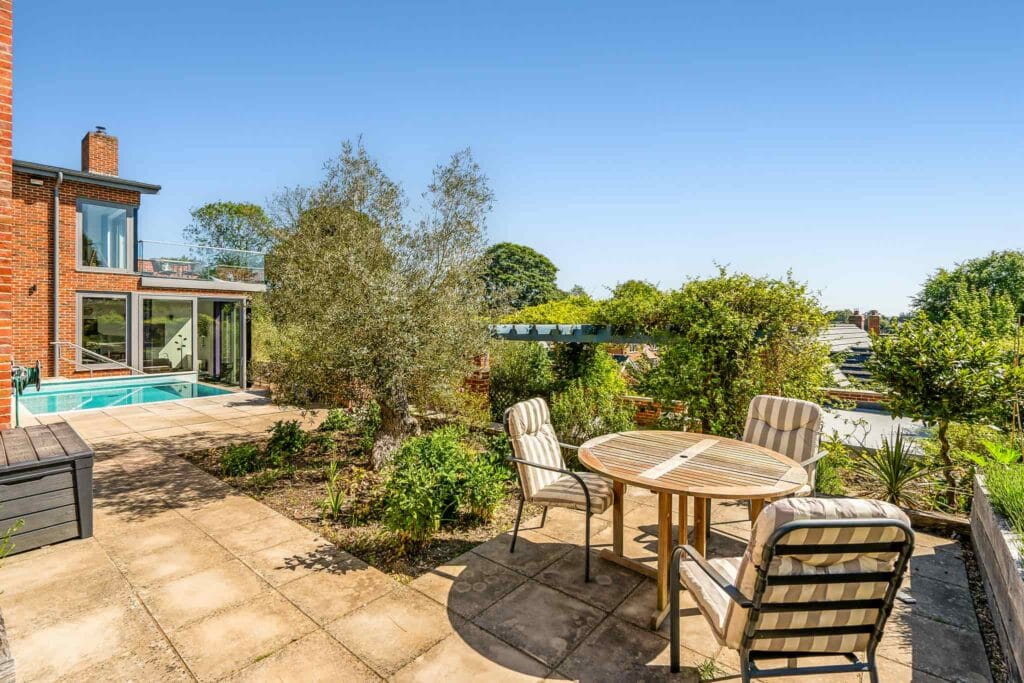 Sunny garden terrace with seating for relaxed outdoor dining.