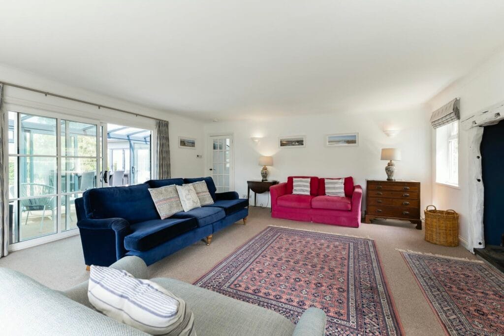 Bright lounge opening onto the garden room