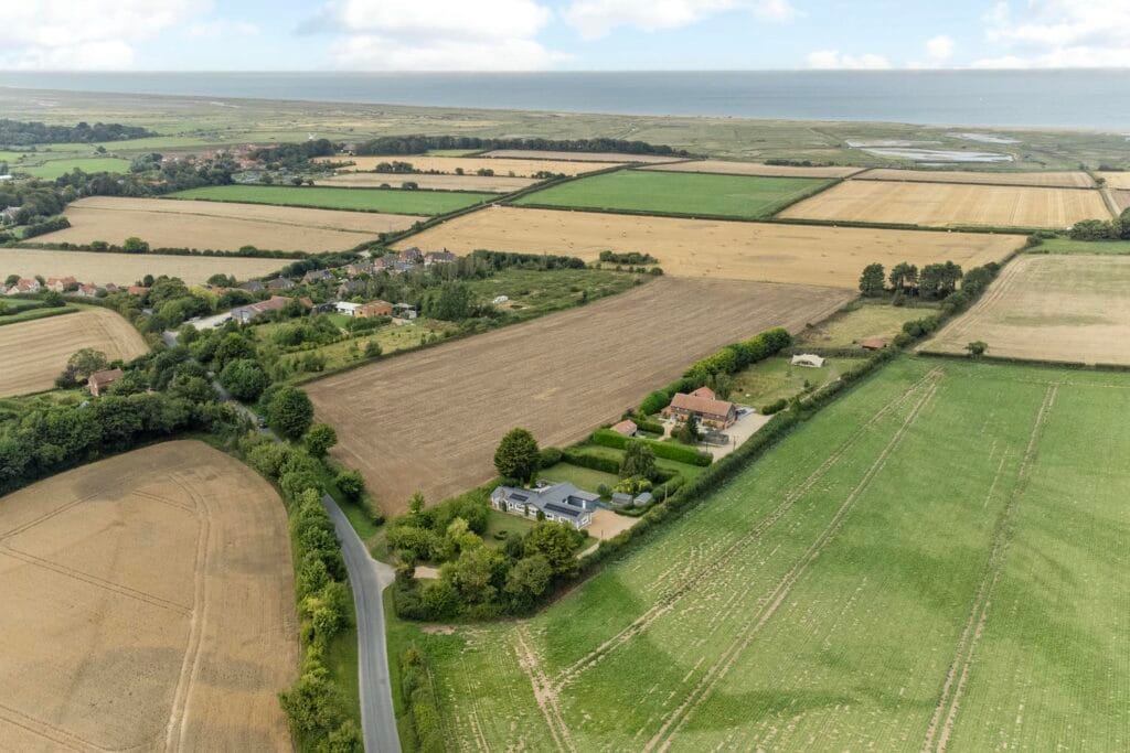 Panoramic coastal views over rolling farmland