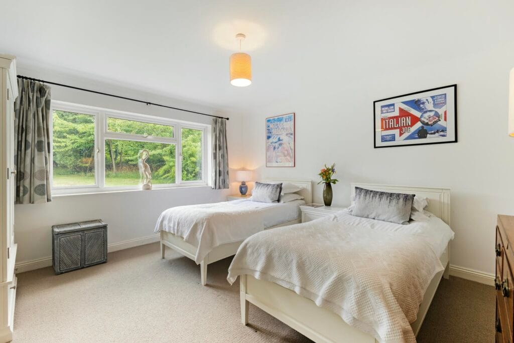 Bedroom three with serene garden outlook