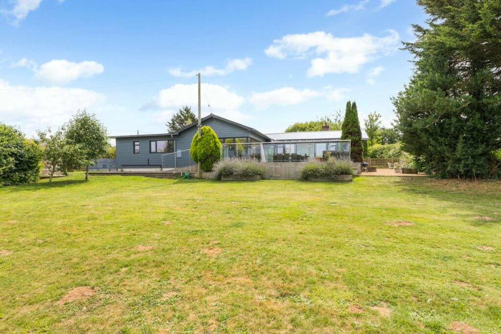 Expansive lawn with elevated terrace views