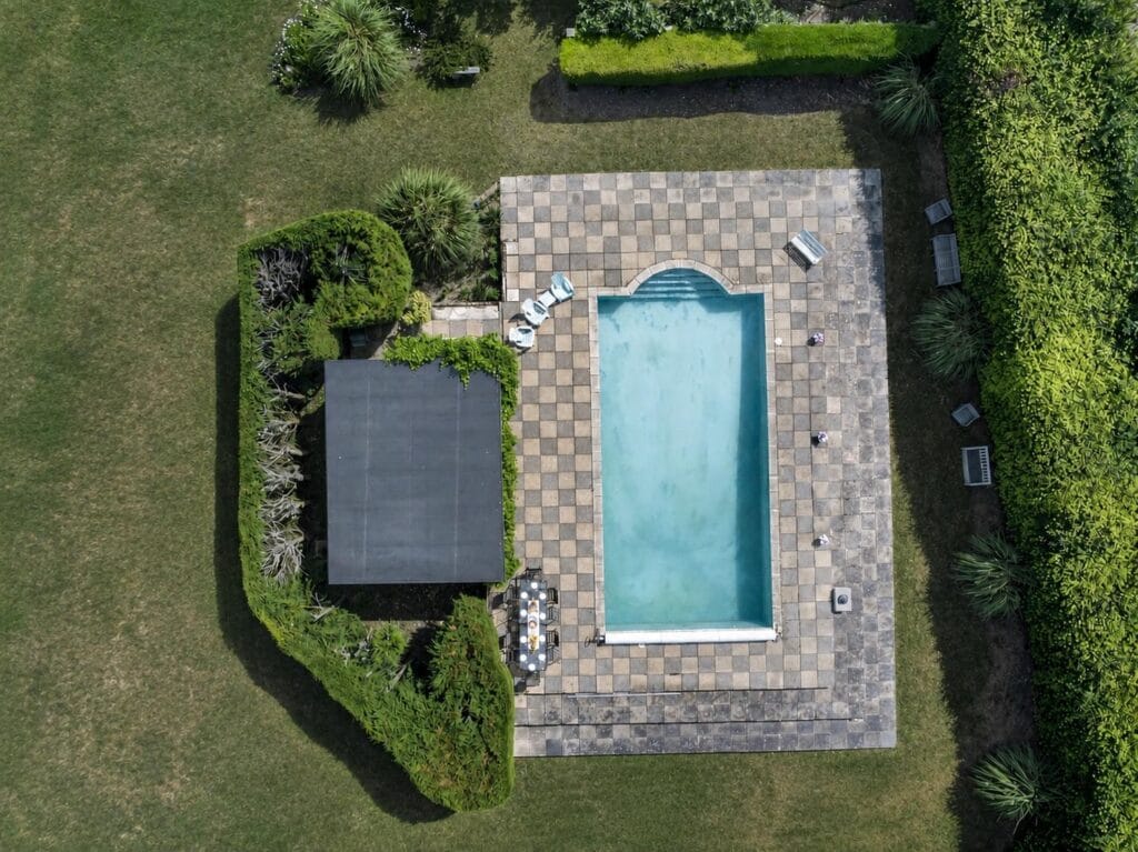 Aerial view of Bury's Hall Ashill outdoor swimming pool and pool house