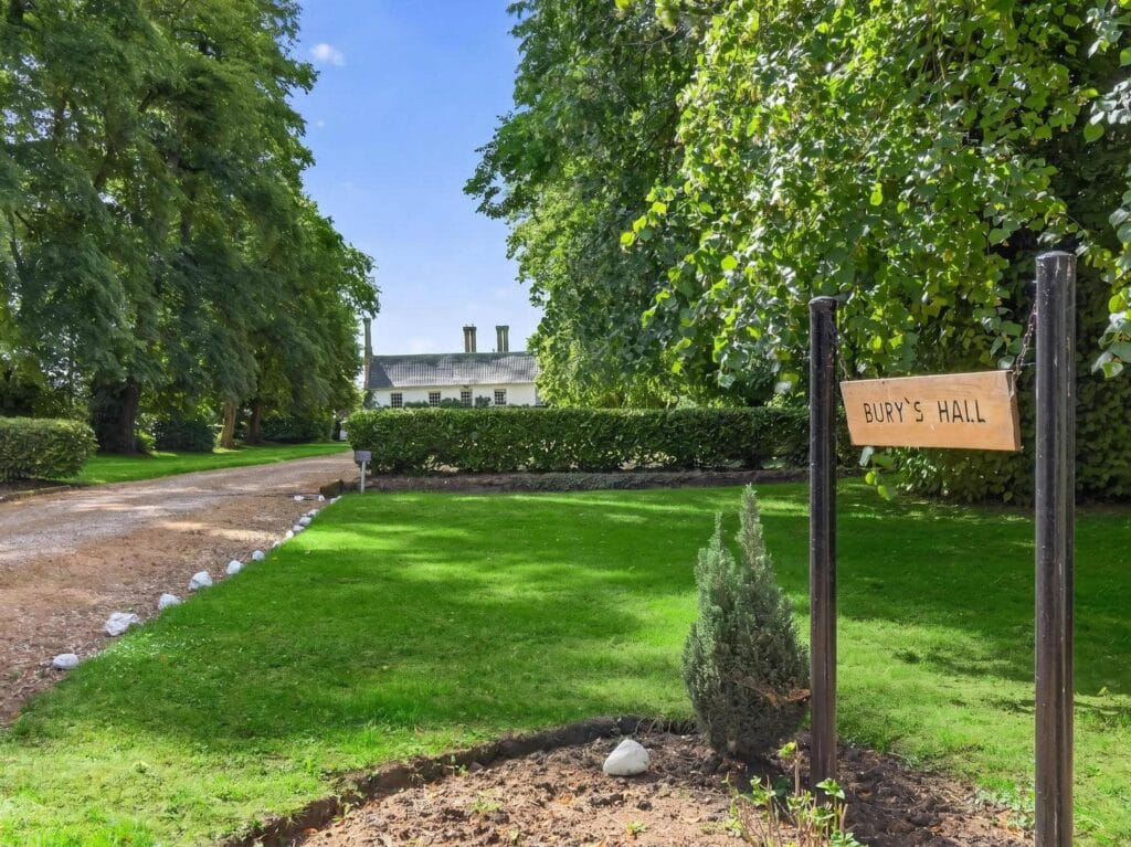 Bury's Hall entrance sign on tree-lined driveway in Ashill Norfolk