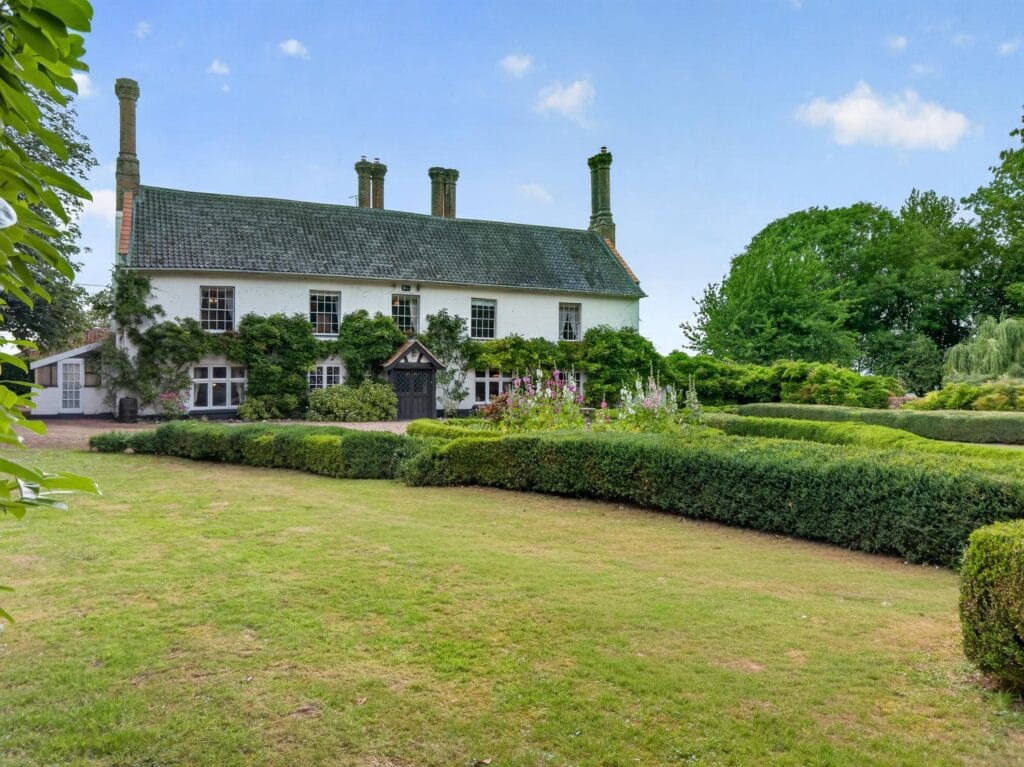 Luxury Norfolk home with manicured lawns and clipped hedgerows