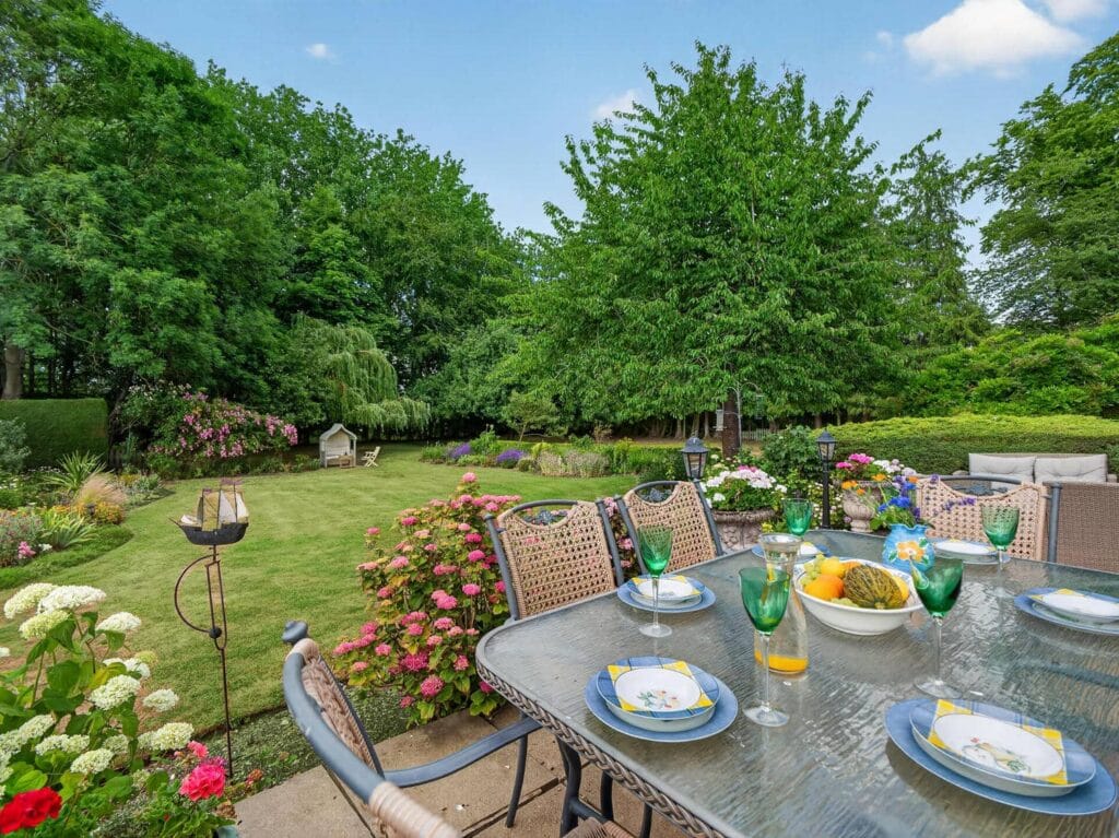 Luxury Norfolk home al fresco dining terrace with garden views
