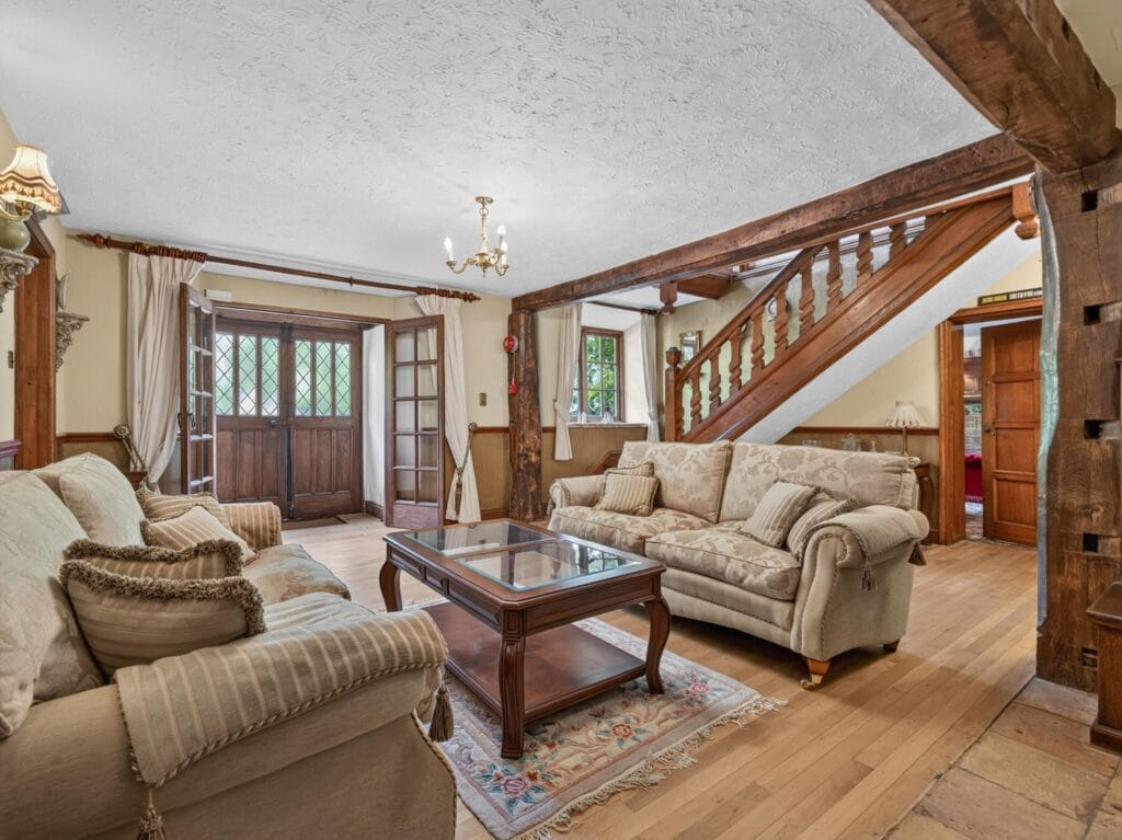 Reception hall with oak staircase, beams and double front doors