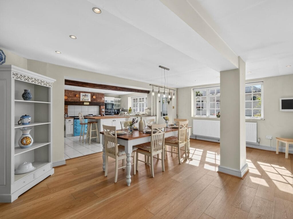 Open-plan dining area with oak flooring at Bury's Hall, Ashill