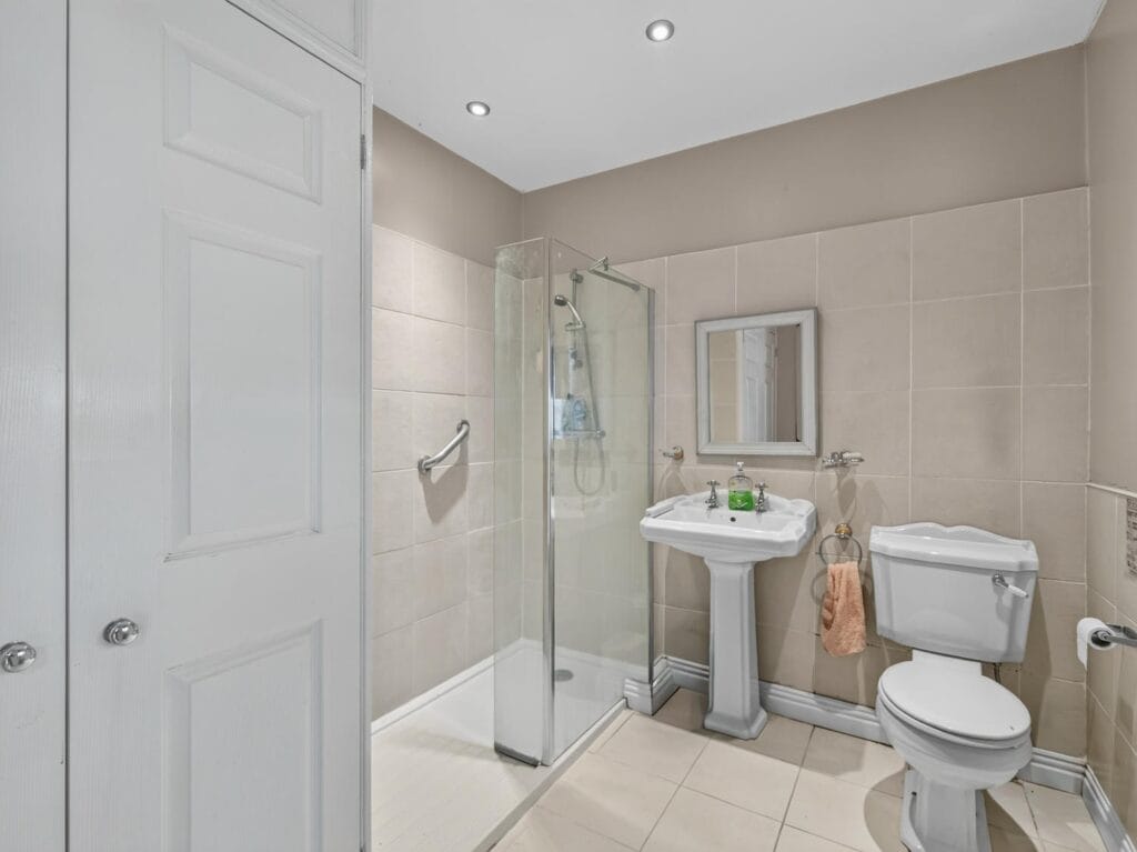 Bury's Hall Ashill tiled shower room with pedestal basin