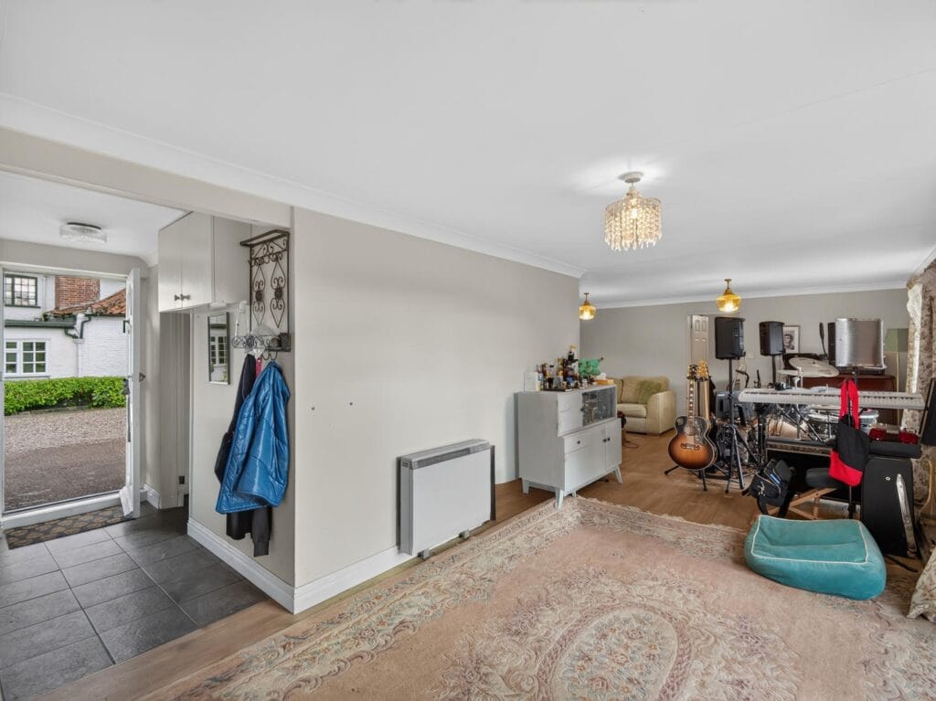 Entrance hallway leading to open plan living area with courtyard views