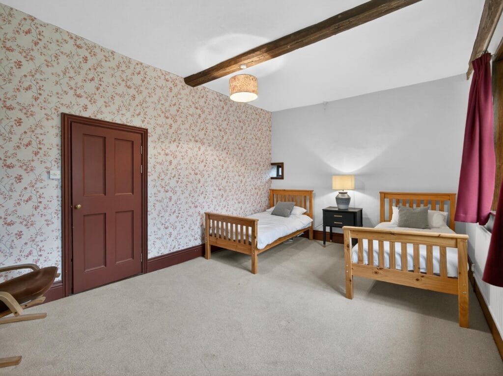 Spacious bedroom with beams