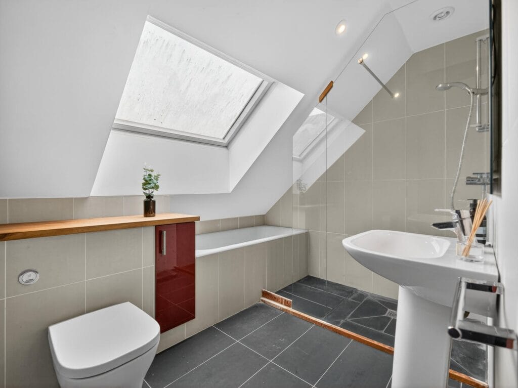 Bathroom with bath and showe
