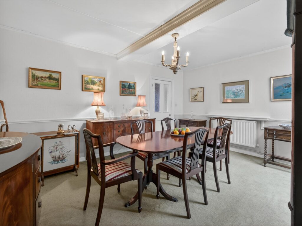 Dining room at The Priory Suffolk with painted ceiling beam, dado rail and proportions for a table of eight