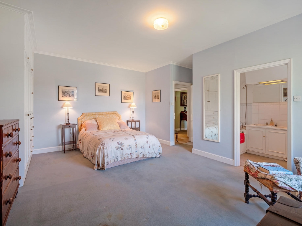 First-floor bedroom with en suite bathroom at Loddon Hall, Norfolk