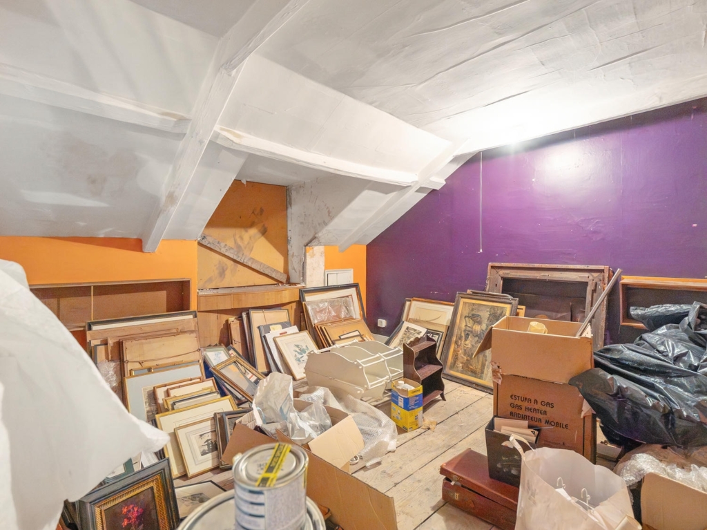 Large loft room with exposed roof timbers and potential to convert at Loddon Hall
