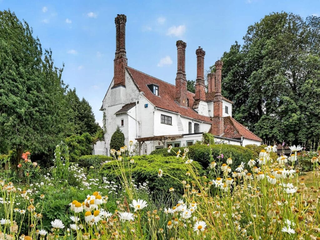 Bury's Hall, Ashill, with wildflower garden and distinctive chimneys